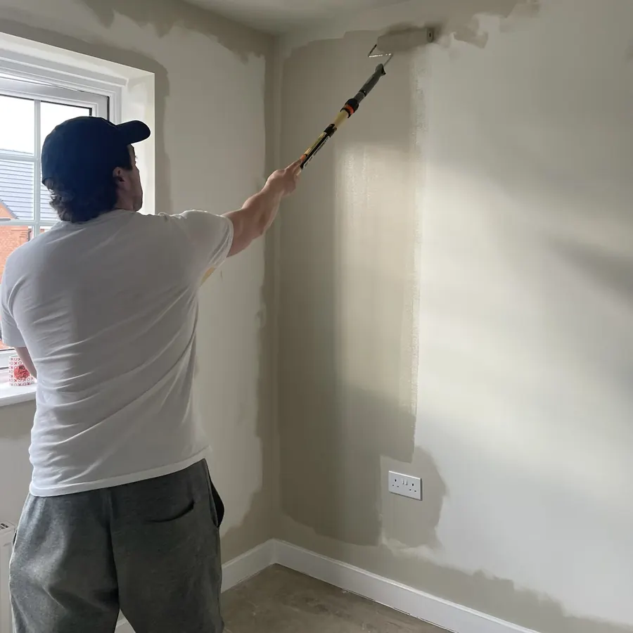 Jack, owner & operator of Cameron Colours, painting his house